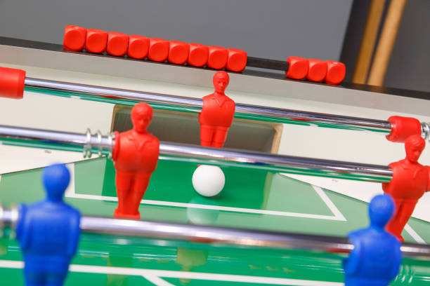 istock Foosball ball on table football table with figures 1206906798