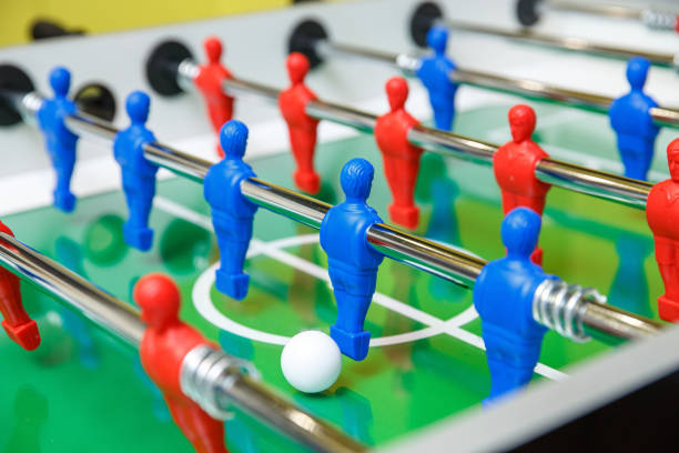 Foosball ball on table football table with figures