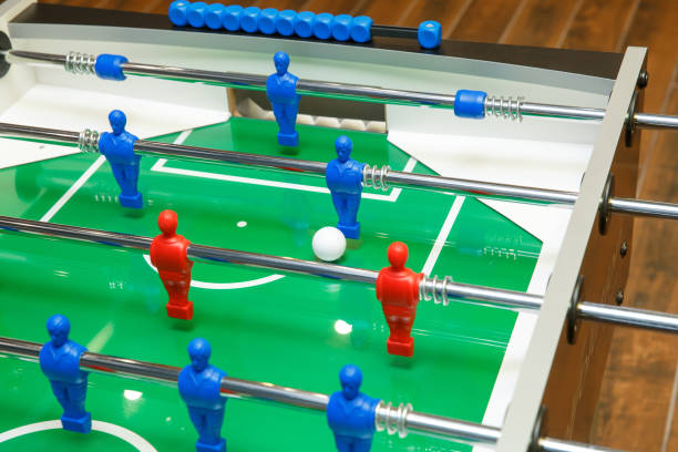 istock Foosball ball on table football table with figures 1206906814