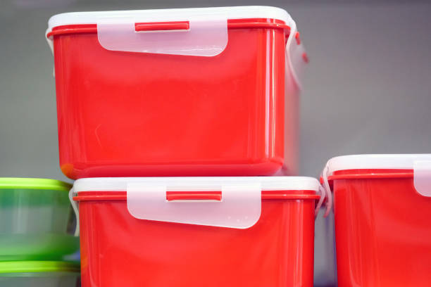 istock Kitchen food containers on a shelf. Plastic color trays of rectangular shape. 1206908809