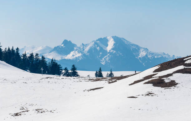 istock Snow covered mountain range in spring on a clear day 1206915013
