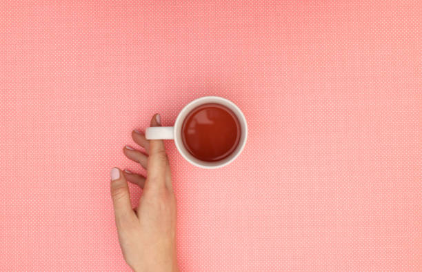 istock Hot healthy cup of tea in woman's hands 1206917502