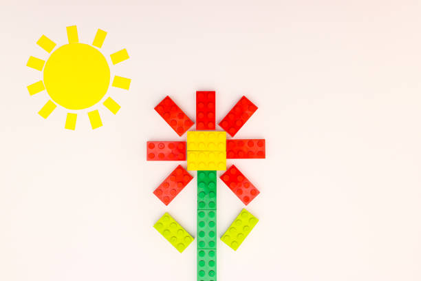 Sun and red flower make of bricks for kids