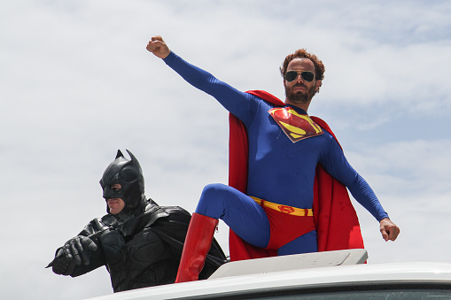 Olinda / Pernambuco / Brazil. February 10, 2013. Revelers have fun costumed in the Block parade Meanwhile in the Justice Room, which parodies characters from comics. A man dressed as a superman is seen at the Olinda carnival.