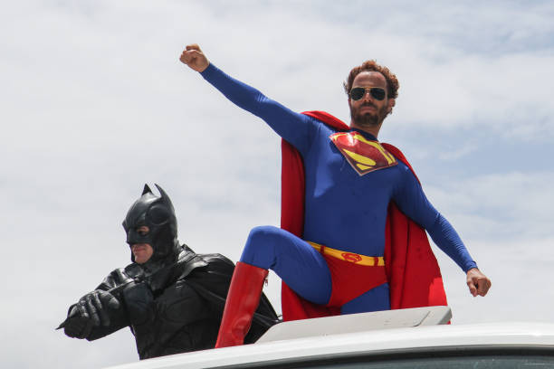 Carnival in Olinda, Pernambuco, Brazil. Olinda / Pernambuco / Brazil. February 10, 2013. Revelers have fun costumed in the Block parade Meanwhile in the Justice Room, which parodies characters from comics. A man dressed as a superman is seen at the Olinda carnival. superman named work stock pictures, royalty-free photos & images