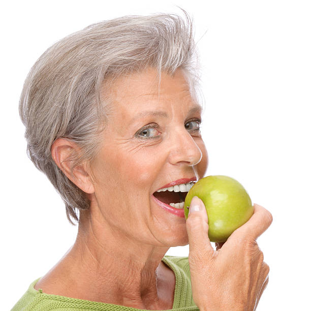 istock Senior woman with apple 120691956