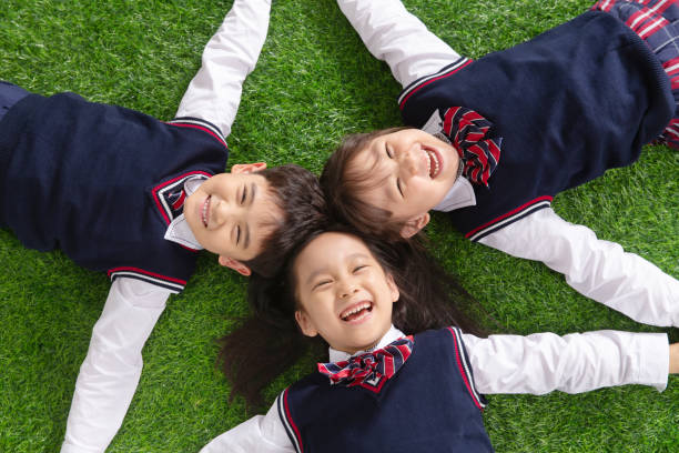 istock The pupils lying on the grass 1206919578