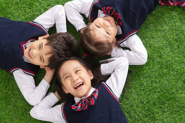istock The pupils lying on the grass 1206919581