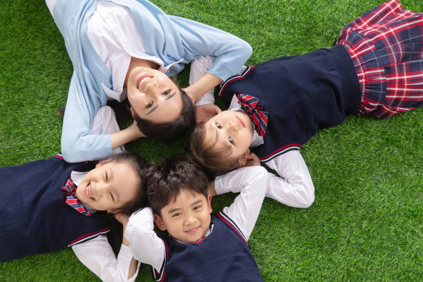 istock The pupils lying on the grass 1206919595