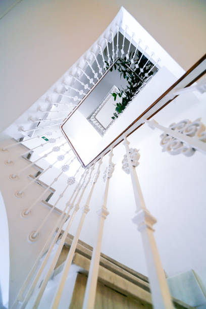 istock View of a staircase and its railing from below. 1206920781