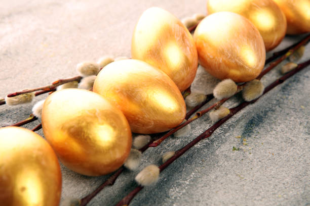 golden easter eggs and pussy willow cats. palmkitten and golden eggs for easter holiday