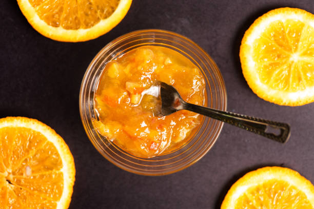 Homemade orange jelly jam in bowl top view