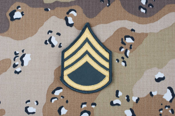 istock US ARMY Staff Sergeant rank patch on desert camouflage uniform background 1206926224