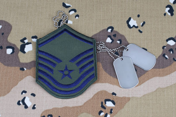 istock US AIR FORCE Master Sergeant rank patch and dog tags on desert camouflage uniform background 1206926318