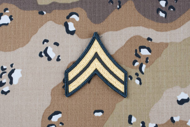 istock US ARMY Corporal rank patch on desert camouflage uniform background 1206926340