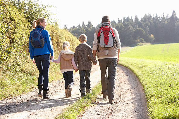 istock Young family walking in park 120692642