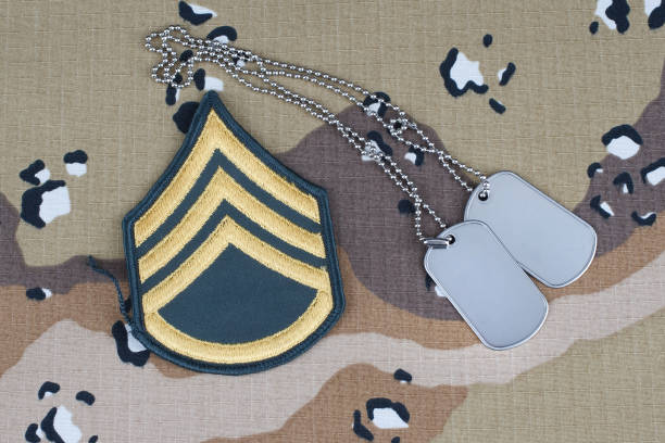 istock US ARMY Staff Sergeant rank patch and dog tags on desert camouflage uniform background 1206926464
