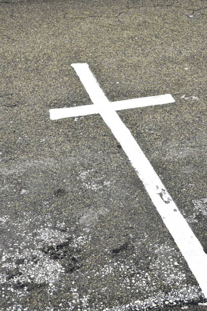 istock Painted Cross on Street 1206928706
