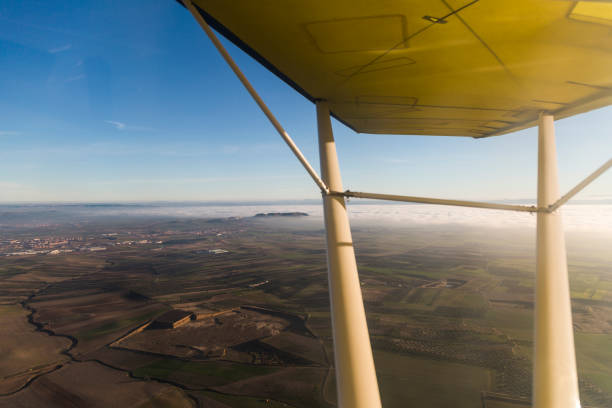 istock view from inside a light aircraft in a cloudy sunset. travel concept 1206929076