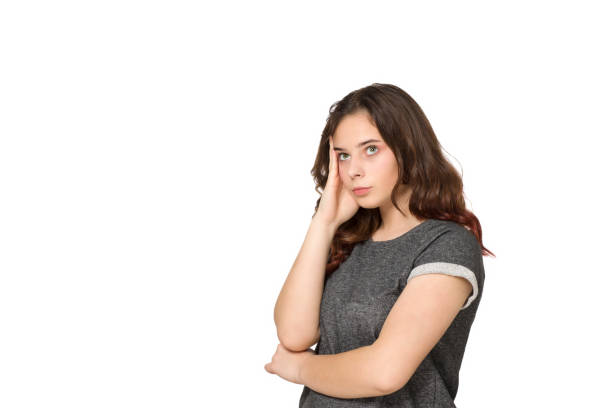 istock Young teenager thinking over a white background 1206929200