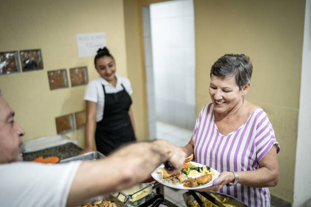 istock Senior woman being served in restaurant 1206929609