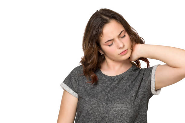 istock Young teen with neck ache on white background 1206930794
