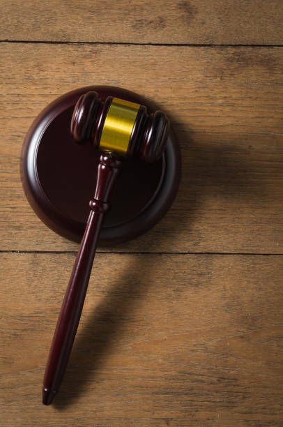 istock gavel on wooden table from top view 1206933069