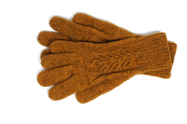 istock Yellow handmade gloves on white background. View from above. 1206933166