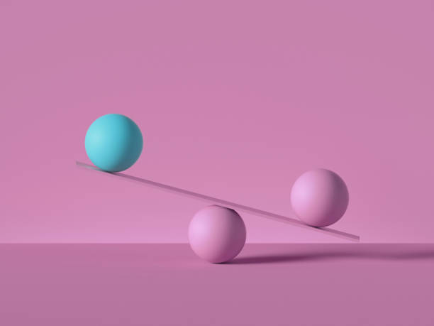 istock 3d render, balancing balls placed on scales or weigher, isolated on pink background. Primitive geometric shapes. Balance metaphor. Modern minimal design 1206935044