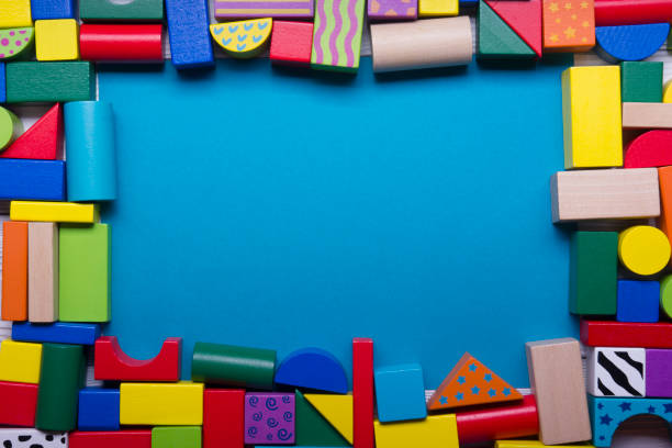Kids educational developing toys frame on white background. Top view. Flat lay. Copy space for text