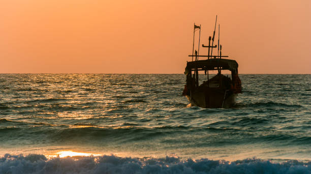 istock Sunrise, ocean and a boat on Koh Rong 1206937657