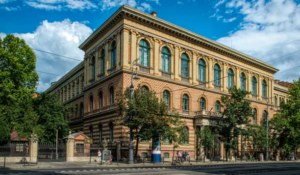 Budapest, Hungary -August 29, 2019: Walls and arched windows of an old gothic building in the historic quarter of Budapest, Hungary. Ancient European architecture of the 19th century. Tourist trip to the capital of Hungary