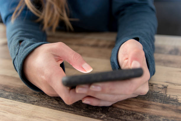 Woman texting on smart phone