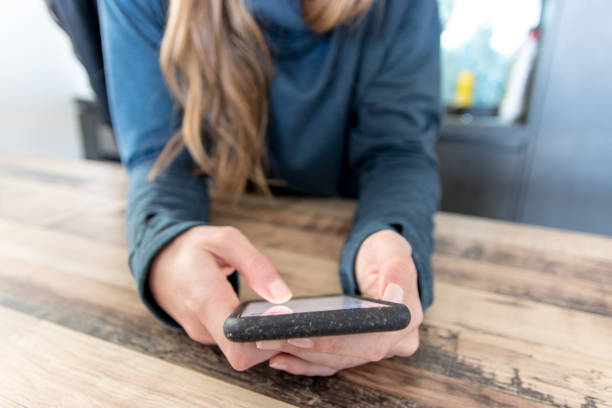 istock Woman texting on smart phone 1206944218