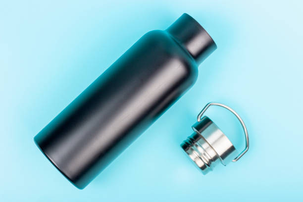 istock A black reusable bottle for water on blue background, top view 1206951317
