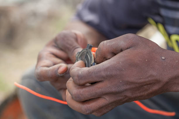 istock Afro Caribbean Man Cutting Grass 1206953912