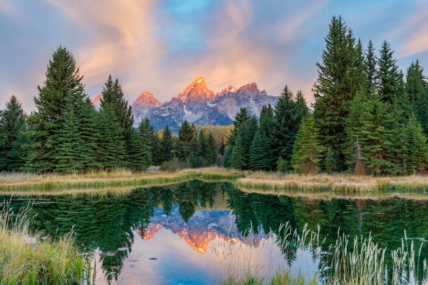 sunrise on the grand teton mountain in the teton range. - snake river teton range mountain range mountain imagens e fotografias de stock