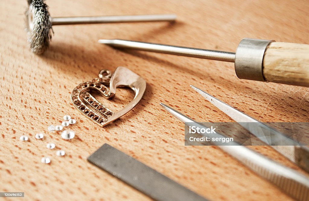 Jewelry Tools Jewellery tools and articles made of gold on the table. Art Stock Photo