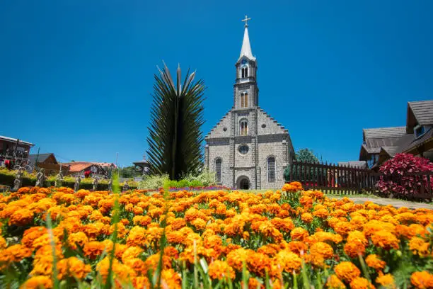 St. Peter's Parish and its beautiful flowered garden. Gramado Cathedral, Rio Grande do Sul, Brazil.