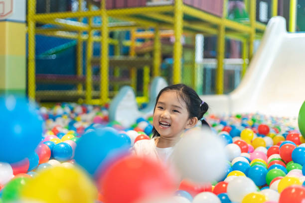 istock Cute girl at the Ball Pool 1206964137