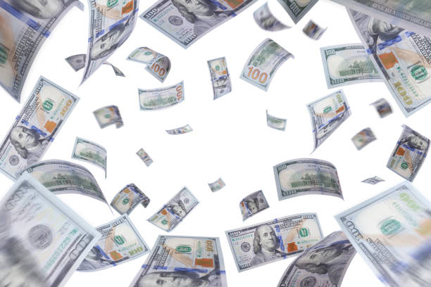 istock One hundred US dollar bills are falling on white background 1206966554
