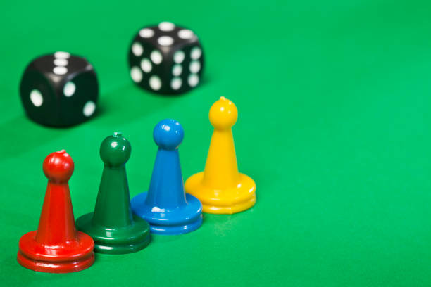 istock Game pieces of different colors and dice 1206968485