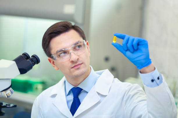 istock Scientist studies properties and benefits of omega 3 fatty acids using microscope and laboratory equipment in a medical laboratory 1206969086