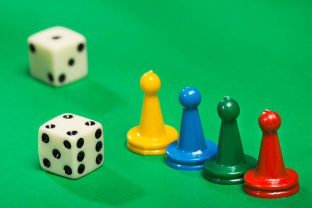 istock Colorful game pieces and dice. 1206969166