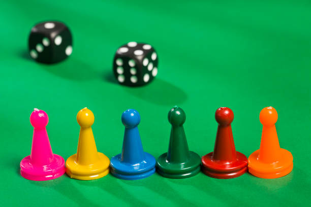 istock Game pieces of different colors and dice 1206969177