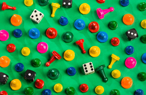 istock Game pieces of different colors and dice 1206969936