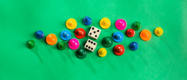 istock Colorful game pieces and dice. 1206969968