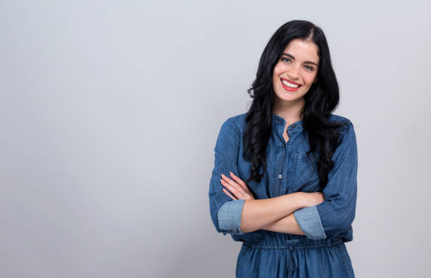 istock Young woman with crossed arms 1206970110