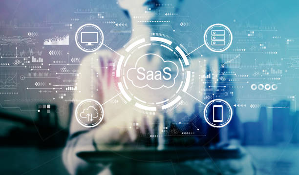 saas - software as a service concept with businesswoman using a tablet - iaas imagens e fotografias de stock