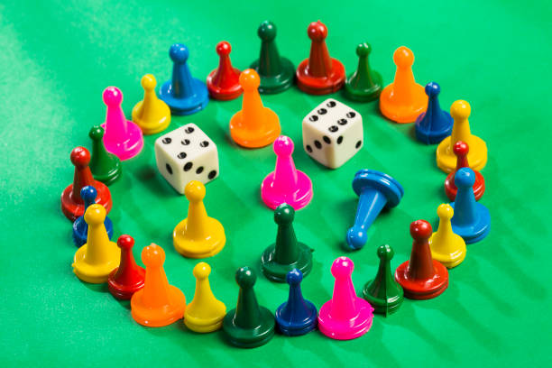 istock Colorful game pieces and dice. 1206971032
